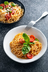spaghetti with tomato sauce and basil