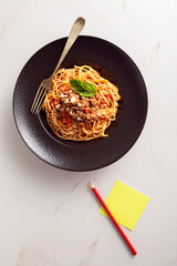 spaghetti with tomato sauce and basil