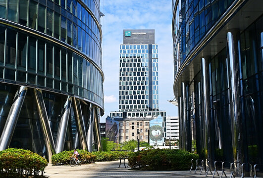 Warsaw, Wola, Poland, Europe - 08.2024 : Warsaw Spire complex, in background Plac Europejski, BNP Paribas Bank and mural 'Kocham Warszawe' (I love Warsaw) 