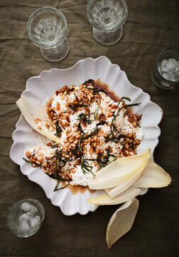 Burrata with endive rosemary and pine nuts