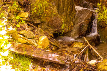 River steam Inn with rocks nature between mountains in Tyrol Austria.