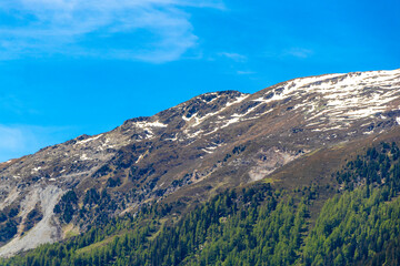 Fototapeta premium Alpine mountain landscape panorama of Lechtal Austria blue sky and snow.