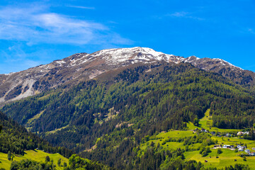 Lechtal Austria alpine mountain landscape panorama blue sky and snow.