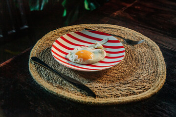 Fried Egg at Breakfast on table