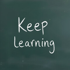 Obraz premium Text written on a blackboard - Keep learning
