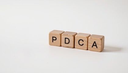 PDCA Plan do check action concept, Blocks spelling PDCA on a white background for business concepts.