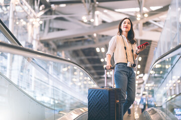 Portrait beautiful adult asian woman using smartphone buying travel insurance claim protect at airport terminal transport