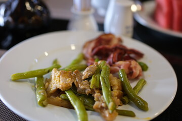 Baked chicken in marinade and penne with Brussels sprouts and green beans. High quality photo