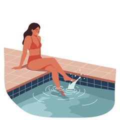 Young woman relaxing by the pool and splashing water with her foot  