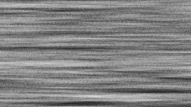 Tv signal noise creates a grayscale image of parallel lines resembling wood grain. Suitable for backgrounds, textures or abstract design projects.