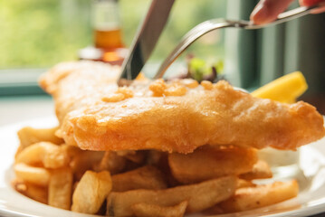 Fish and chips with mushy peas and tartar sauce. Traditional English food.