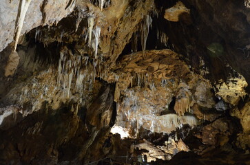 Inside of beautiful old dark cave with many stalactites. Grotte di Is Zuddas, Italy, Sardinia