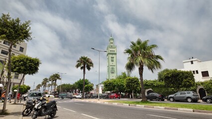 Obraz premium Mosque Masjid Mimosa Minaret Under Blue Sky – Aïn Sebaâ, Casablanca Morocco June 16, 2025 