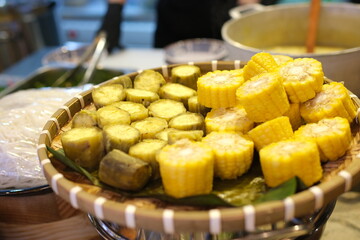 Steamed sweet potato or Shakhar Kandi in a plate. Steamed root sweet potato. Corn pieces