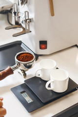 Espresso Grounds for Two Cups in Coffee Shop With Professional Machine and Scale on Professional...