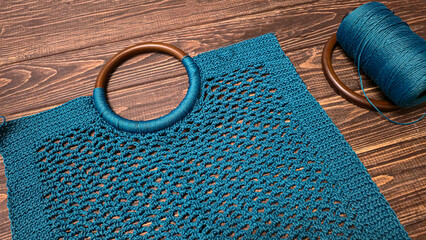 Knitting a product from a cord with a crochet hook. Step-by-step instructions