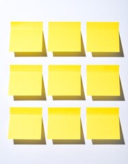 Blank yellow sticky notes on white background, illustrating business, teamwork, and brainstorming concepts. Sticky notes paper with shadow, providing copy space