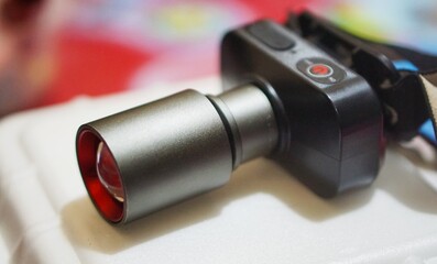 black zoom lens headlamp