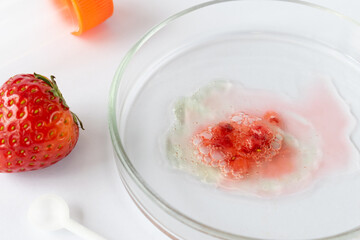 Strawberry in Petri dish with advanced Botrytis cinerea infection, extensive surface mold...