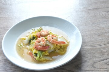fried slice cabbage with shrimp in soy sauce on plate
