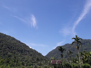 Beautiful natural scenery, with mountains and sky on a clear day. Showing the natural beauty of the countryside of Aceh province.