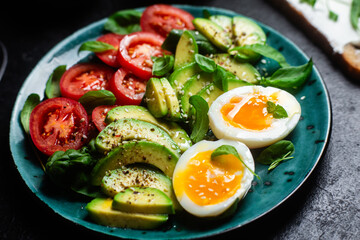 Healthy Breakfast with Avocado, Egg, and Tomato on a Plate