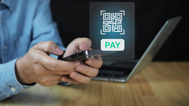 QR code scanning payment and verification. Hand using mobile smart phone scan QR code Qr code payment , online shopping , cashless technology concept. Shop or store accepted digital pay without money.