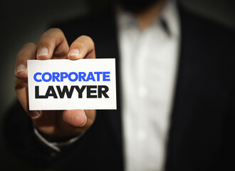 Corporate Lawyer showing his card close up background. Lawyer, tax, corporate, law.