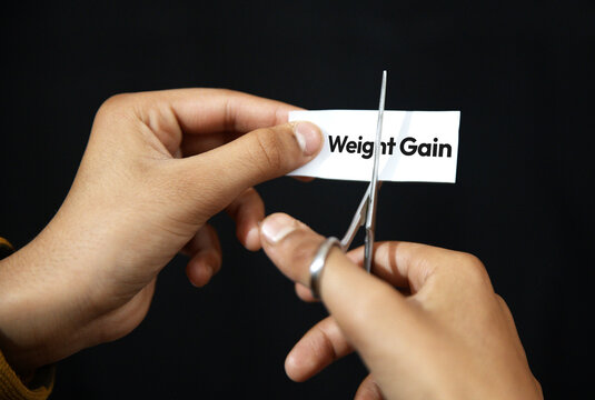 Cutting weight gain typography with pair of scissor, background. Health, bad habits, obease