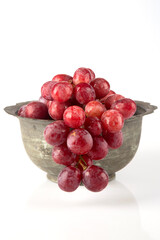 Red grapes in metal basket 