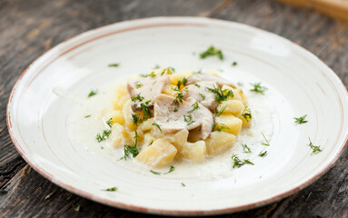 Potatoes with porcini mushrooms and dill on a plate