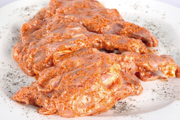 Raw chicken thighs in sauce