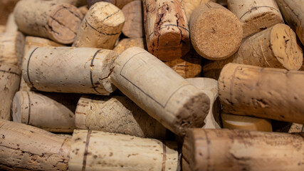 Pile of used old wine corks from restaurant. It can use as pattern textured background.