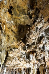 Inside of beautiful old dark cave with many stalactites. Grotte di Is Zuddas, Italy, Sardinia