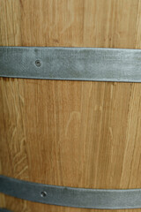 High-resolution image of a wooden barrel's textured surface and metal bands. Perfect for rustic designs.