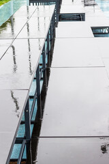 Abstract background. Stadium stand after rain. Reflections in puddles.