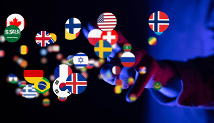 Hand interacting with floating flags, symbolizing global connections and international...