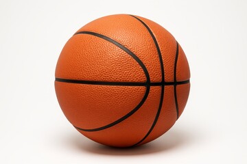 Basketball resting on a flat surface illustrating the essence of the sport in a minimalist setting