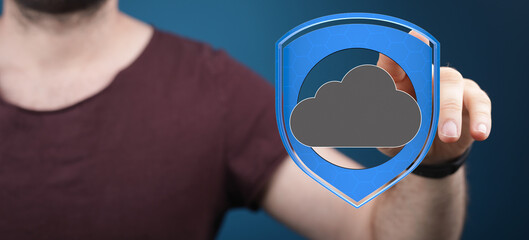 Cloud security concept.  Man interacts with a digital shield protecting cloud data.  Safe and...