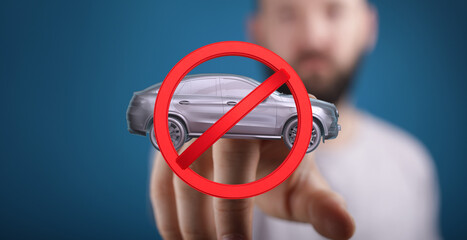 Image of a hand holding a no car symbol, representing vehicle restrictions or prohibitions.