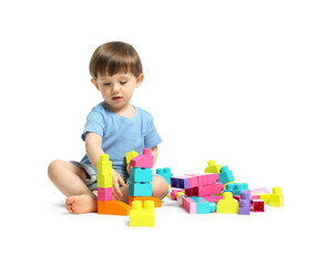 Cute little boy playing with building bricks on white background