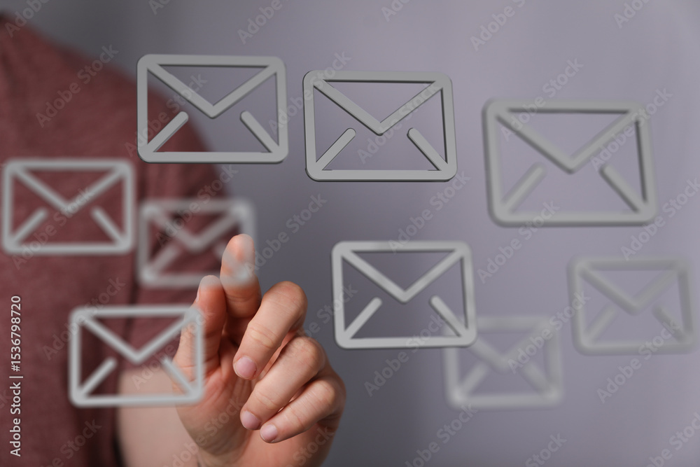 Poster Hand interacting with digital email icons, representing communication and inbox management.