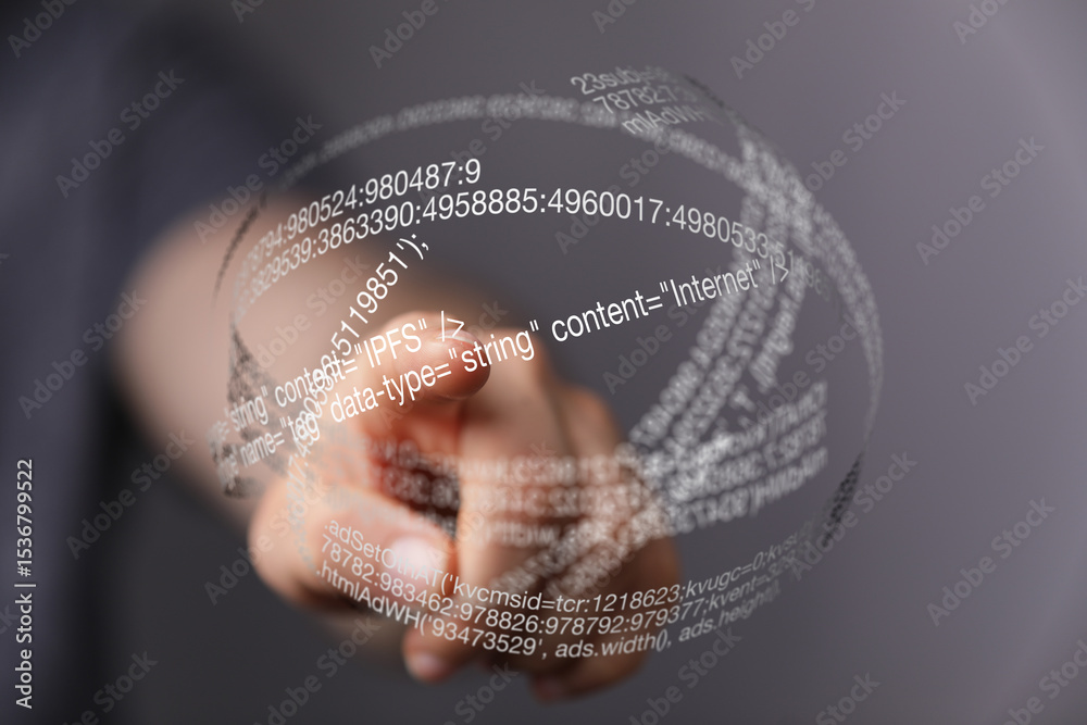 Aufkleber Close-up of a hand interacting with a digital holographic display showing lines of code.
