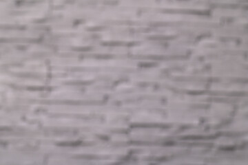 Blurry gray background, blurry gray brick wall, everything is out of focus