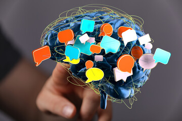 Abstract image of a brain with speech bubbles, representing communication, ideas, and thoughts.