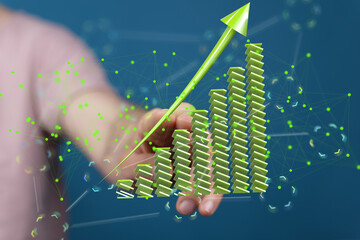 Green upward arrow graph illustrates business growth, success, and progress.  Ideal for financial...