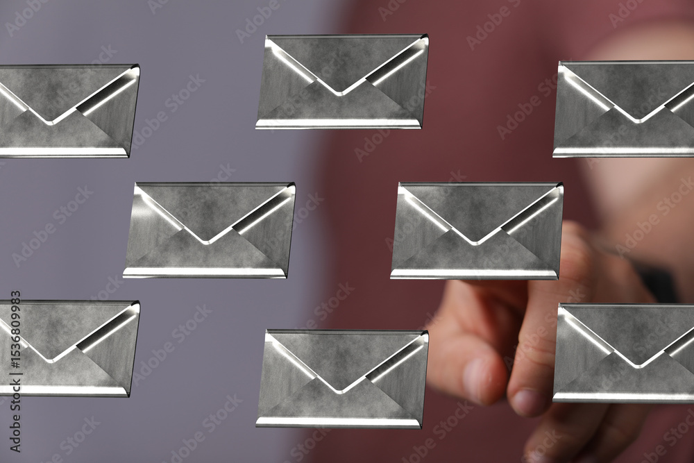 Poster Abstract image of a man interacting with floating email icons.  Concept for communication, inbox, digital mail.