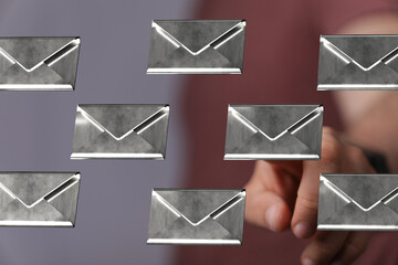 Abstract image of a man interacting with floating email icons.  Concept for communication, inbox,...