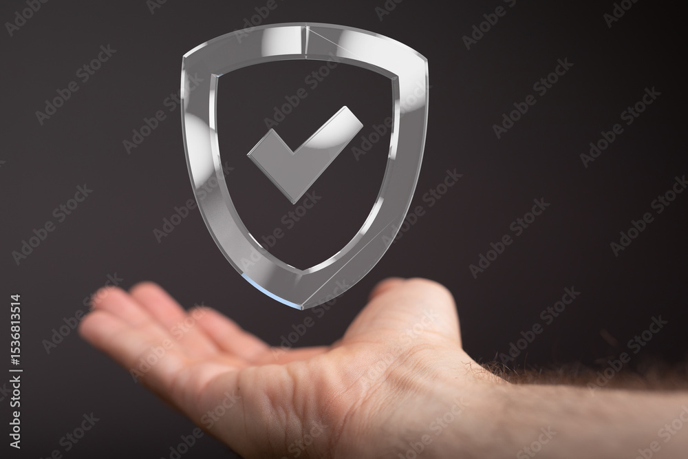 Poster a hand holds a transparent digital shield with a checkmark, symbolizing data protection and security