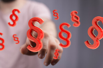 Abstract image of red paragraph symbols.  Ideal for legal, law, or justice concepts.
